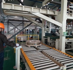 Coil and strip stacker